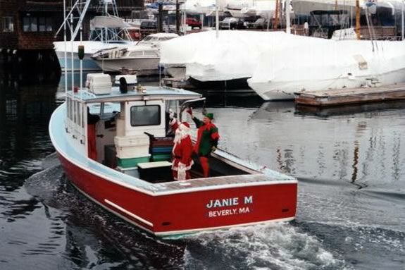 Santa arrives in Beverly Harbor by lobster boat.