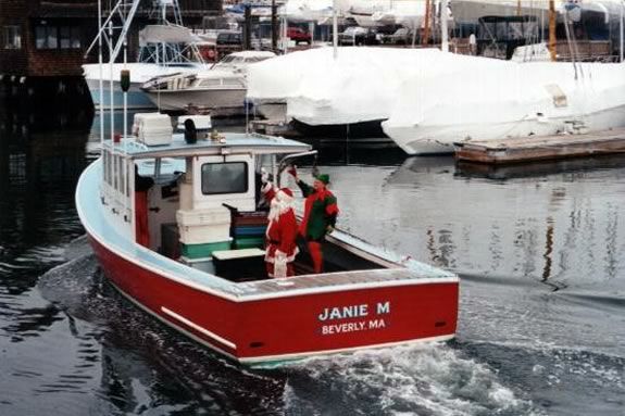 Santa arrives in Beverly Harbor by lobster boat. Santa arrives in Beverly Harbor by lobster boat.