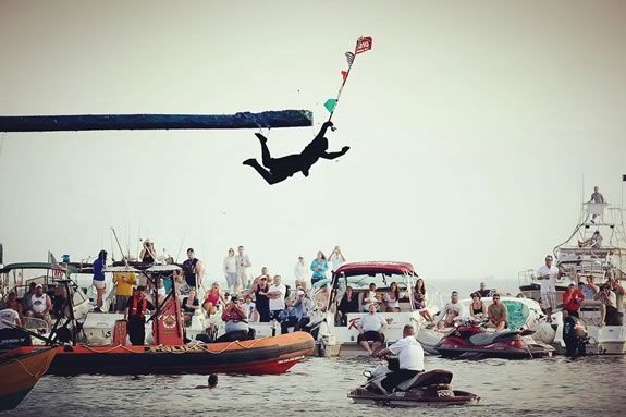 A highlight event at St. Peter's Fiesta in Gloucester, MA is the infamous Greasy Pole contest near Pavilion Beach